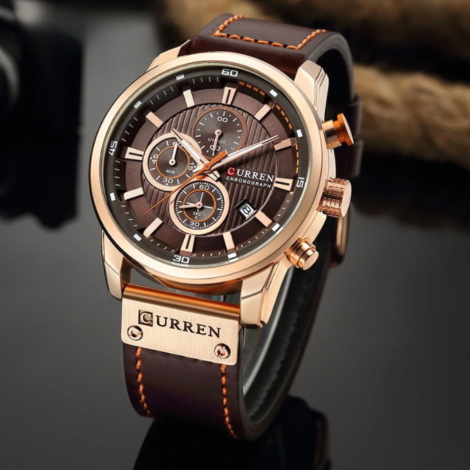 Rose Gold trim and brown cowhide leather strap, standing upright