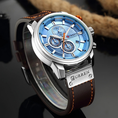 Silver trim with blue internal color. Dark Brown, 100% cowhide leather strap